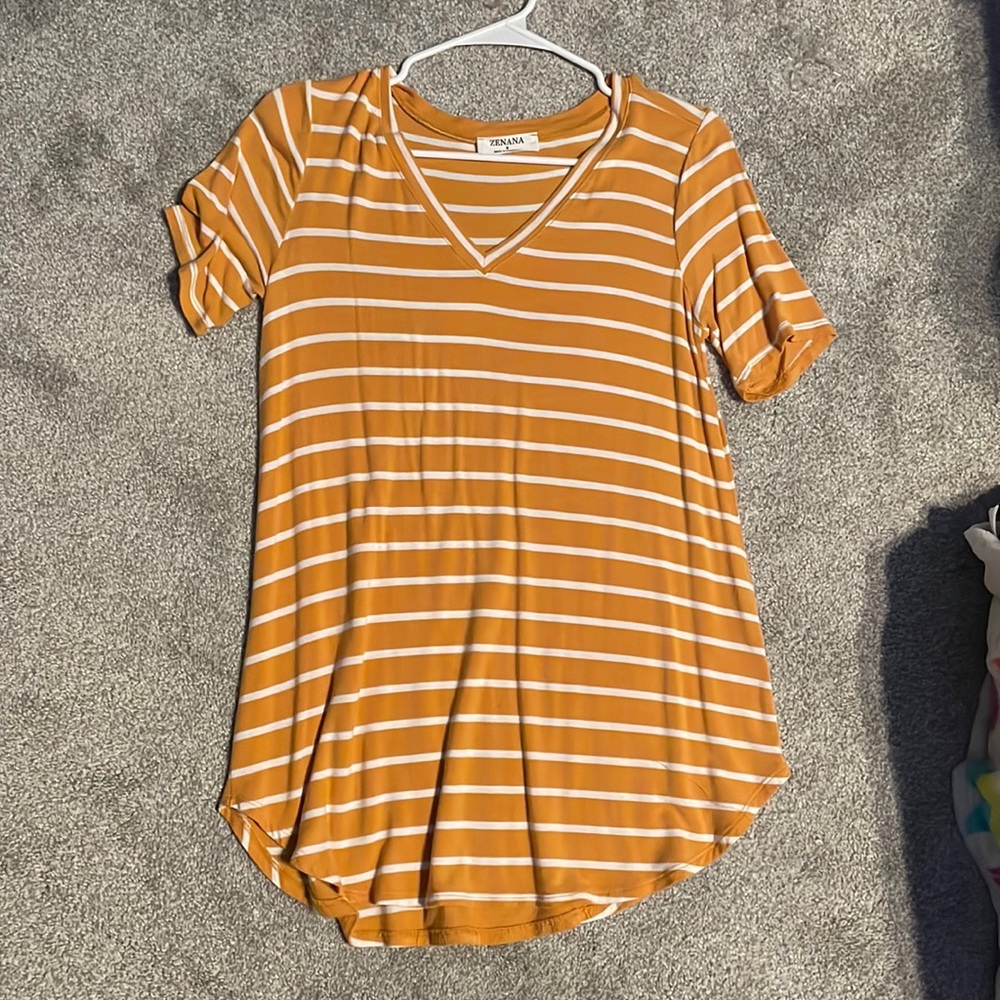 Very stretchy, soft, and long yellow and white shirt.